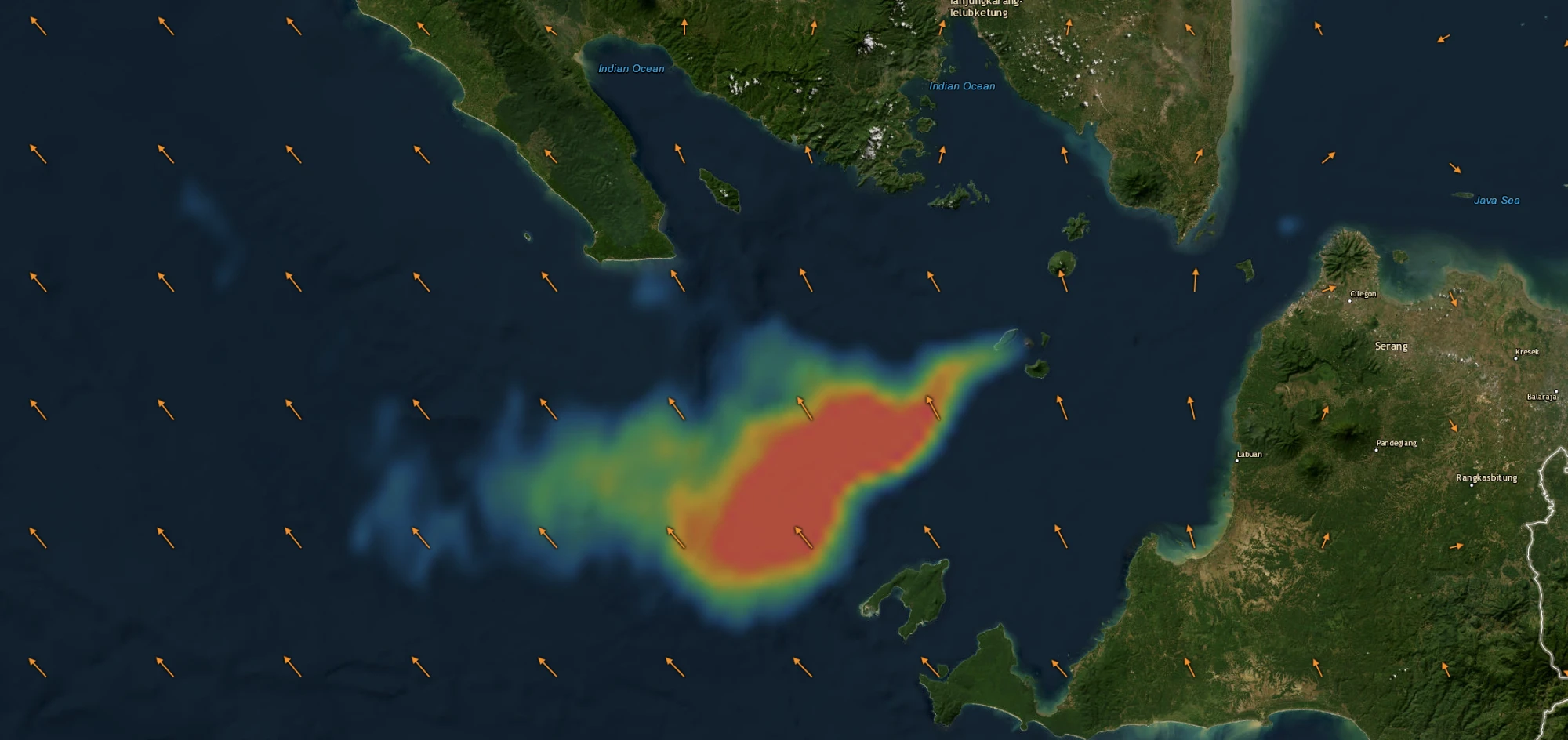 SO2 concentration rendered as a blue-to-red heat ramp over the Sunda Strait between Sumatra and Java, Indonesia, fused with orange NOAA GFS wind-direction arrows on a hybrid satellite basemap labelled with place names — Serang, Cilegon, Labuan, Pandeglang, Rangkasbitung, the Java Sea and the Indian Ocean.
