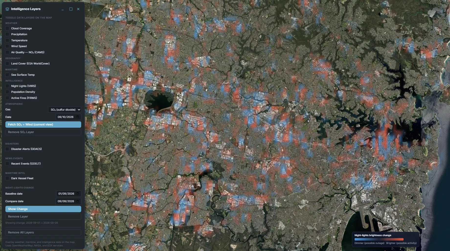 VNP46A2 night-lights brightness change overlay across Sydney, Australia, dense red patches marking brighter areas (possible new activity) and blue patches marking dimmer ones (possible outages) scattered through the city grid near Sydney Airport, with the Intelligence Layers panel open showing Night-Lights Change set to compare 2026-09-01 against 2026-09-09 and a blue-to-red brightness-change legend.